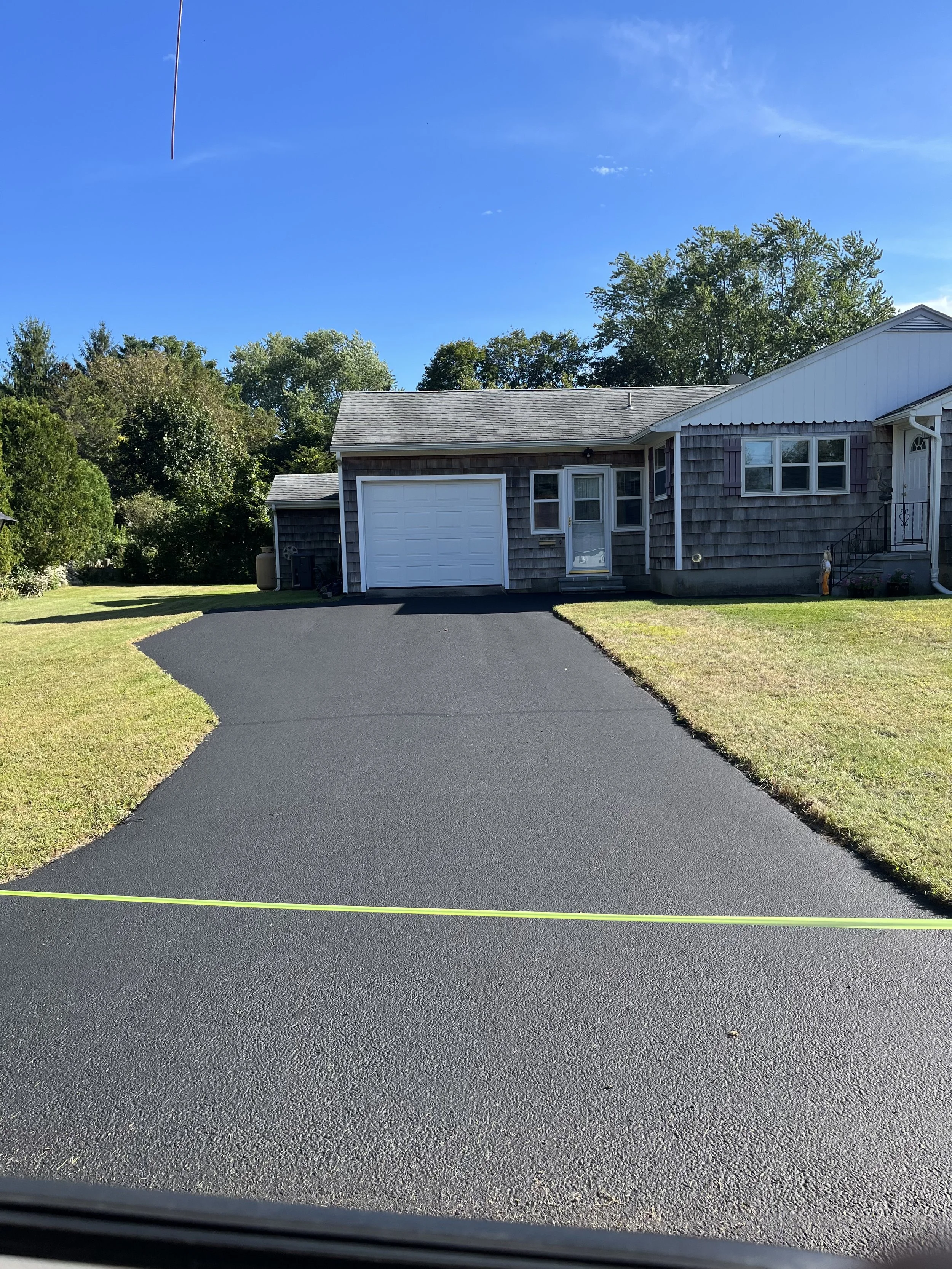 Driveway sealing in progress